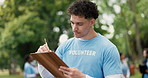 Outdoor, volunteer or man with clipboard, checklist or community service with registration. NGO project, documents or person with planning, nonprofit sign up or inventory for donations or earth day