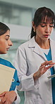 Women, doctor and tablet with folder in hospital for research, medical results and surgery schedule. People, team and digital with patient chart, healthcare report and discussion of treatment options