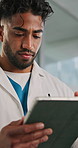 Doctor, man and scroll in hospital with tablet for patient info, medical research and test results. Healthcare worker, person and planning with digital tech for appointment schedule, admin and email.