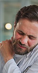 Upset, doctor or massage in office with shoulder pain from healthcare stress, muscle ache or tension. Bokeh, medical worker and man in workplace with joint inflammation, discomfort and injury relief.