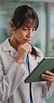 Doctor, woman or thinking in hospital with tablet for patient info, medical research or test results. Healthcare worker, person reading or scroll with tech for problem solving, diagnosis and insight.