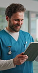 Tablet, man and nurse in hospital with medical research for diagnosis, treatment plan or telehealth. Digital technology, communication and male healthcare worker with patient information in clinic.