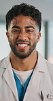 Face, doctor and man in hospital with smile for healthcare advice, career development and growth. Happy, medical professional and person with pride for patient support, job satisfaction and about us.