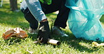 Cleaning, hands and recycling with volunteer outdoor for charity, community service or sustainability. Conservation, earth day and waste with person on grass field in park for ngo or non profit work
