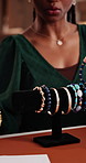 Jewelry rack, hands and talking for product purchase, handmade accessory and saleswoman with pitch. Communication, entrepreneur and boutique owner with luxury bracelet, persuasion and convince buyer