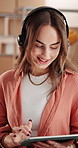 Conversation, headset and tablet with woman in logistics office for online shopping feedback or support. App, communication and smile of happy supplier in supply chain workplace for consulting