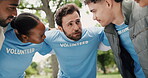 Volunteer, people or huddle in park with discussion for eco project, outreach or nonprofit service. Team outdoor, hug or conversation for charity work, climate change program or social responsibility