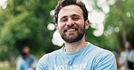 Face, volunteer and man outdoor with smile for eco friendly project, outreach and nonprofit service. Happy, person and charity work in park for sustainability program, social responsibility or bokeh.