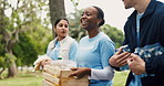 Happy people, food donation or volunteer team at park for walk, hunger relief or laugh. Charity, funny or outdoor with groceries for NGO, community service or distribution to help for poverty support