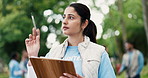 Clipboard, planning and woman volunteer outdoor with social responsibility, ngo or charity event. Writing notes, nature and female person with checklist or schedule for community outreach in park.