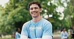 Face, volunteer and happy man in park with arms crossed for eco project, outreach or NGO service. Confident, person outdoor or charity work for climate change program, social responsibility or bokeh.