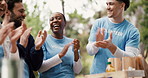 Volunteer, team or people outdoor with clap, collaboration or milestone reach in community service project. Happy, group or NGO in park with applause, motivation or outreach goal in charity campaign.