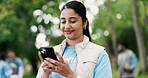 Phone, smile and volunteer woman in park for charity, community outreach or donation update. App, search and typing with happy person outdoor for social media post of ngo or non profit mission