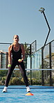 Padel, court and woman with balls, training and active for competition preparing, happy and applause. Outdoor, tennis player and people with racket for match, wellness and clapping after practice
