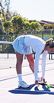 Fitness, woman or stretching exercise on tennis court to start practice, match flexibility or health. Sport player, athlete or warm up for tournament training, sports performance or game coordination