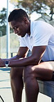 Thinking, man or break on bench for tennis competition, tournament strategy or tactical mindset. Reflection, black person or athlete on court with equipment for game plan, sports match or preparation