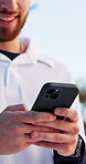Fitness, typing or hands outdoor with smile, online communication or post reaction on workout break. Sport, digital or athlete in park with phone, chat message or social media update in training rest