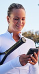 Phone, fitness and woman on tennis court with networking, contact or social media on mobile app. Happy, sports and female athlete with cellphone for communication, chatting or research outdoor.