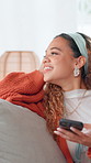 Thinking, happy and woman on sofa with phone for social media, online message and funny chat. Home, living room and person on smartphone laughing for internet joke, website or connection on weekend