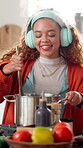 Headphones, woman or cooking with dancing in kitchen for meal prep, music playlist or lunch recipe. Stove, happy girl or streaming radio in home for homemade brunch, nutrition diet or positive energy
