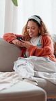 Relax, happy and woman on sofa with phone for social media, online message and funny chat. Apartment, living room and person on smartphone laughing for internet joke, website or connection on weekend