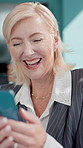 Texting, business woman and laugh with phone in office for investment contact, funny client and chat. Finance manager, happy mature person and smartphone at firm for funding approval and good news