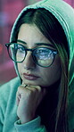 Hacker, woman and tech with thinking at night for password phishing, fraud and install malware. Cyber crime, glasses reflection and person with PC for unauthorized access and network breach with neon