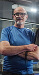 Arms crossed, face and padel with mature man on court for competition, game or tournament. Exercise, fitness and tennis with confident person at sports venue for match, practice or training session