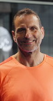 Face, fitness and mature man at padel for training, match or workout for wellness in morning. Happy, sports and portrait of male athlete with confidence for practice, game or exercise at indoor court