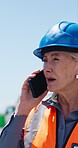 Phone call, discussion or woman outdoor for construction, instruction or conversation on project progress. Communication, mature or supervisor on site with tech, ppe or walk in field inspection.
