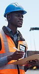 Construction site, clipboard or black man writing for inspection, safety protocol or development check. Project management, outdoor or worker with progress report for review, quality control or below