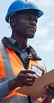 Black man, construction worker and writing on clipboard for inspection, thinking or property development. Person, site manager and contractor with safety checklist, building project or infrastructure