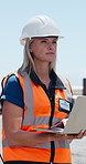 Woman, laptop and thinking outdoor for supply chain, logistics or typing with storage plant inspection. Person, technician and computer with helmet, shipping or inventory management for distribution