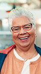 Face, laugh and senior woman in house for joke, comic and comedy on weekend break in apartment. Portrait, funny and elderly person in home for retirement, humor and wellness with glasses in Brazil