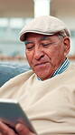 Happy, laughing and tablet with old man on sofa for social media joke, streaming video or comedy. Online funny post, digital update and retirement with senior person and scroll in living room of home