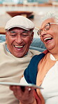 Joke, laughing and tablet with old couple on sofa for social media meme, streaming video and comedy. Online funny post, digital update and retirement with senior man and woman in living room of home