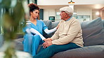 Consulting, healthcare and nurse holding hands with old man on sofa in living room for support. Advice, empathy or feedback with caregiver and senior patient in home for medical checkup or review