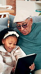 Child, talk and grandfather with tablet in home for movie, cartoon or education. Happy girl, grandparent and technology in living room for learning, online app and bonding with family generations