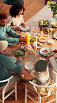 Lunch, thanksgiving and above of family in dining room for nutrition, bonding and festive gathering. Health, holiday season and food with people eating in home for reunion, relax and meal together