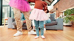 Legs, home and father with girl, dancing and bonding together with fun, learning and playful. Family, apartment and dad with daughter, teaching and support with love, music and help with happiness