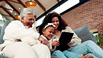 Grandma, mother or child with tablet in home for bonding together, conversation or play on kids app. Old woman talk, happy mom or daughter with generations on sofa for tech, online game or low angle.