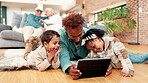 Bonding, love and tablet with family on floor in living room of home for break or streaming. App, relax or watching video with father and sibling children in apartment for subscription entertainment