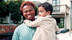 Laugh, backyard and face of dad with child for bonding, loving relationship and connection in new home. Family, parenting and portrait of happy man carry boy for trust, support and affection outdoor