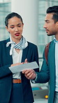 Business, man and attendant with passport at airport for travel instructions of flight departure. Person, air hostess and help with airplane ticket, terminal inquiry and gate directions for boarding