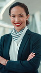 Happy woman, face and airport with flight attendant for business class, travel service or commute. Portrait, female person or gate agent with smile, confidence or arms crossed for airline safety