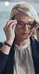 Review, glasses or woman in office with laptop, research update or planning in project management. Corporate, reflection or employee in agency with reading, draft edit or information check for report