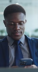 Business, cellphone and black man in office, financial advisor and email for revenue growth. Person, investor and employee with smartphone, chatting and online reading with digital app for trading