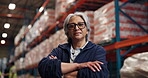 Logistics, face or woman with arms crossed in warehouse for shipping, quality control or about us. Distribution manager, mature person and serious for stock management, export service or supply chain