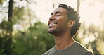 Breathing, fitness and happy man outdoor for relax, break or mindfulness for wellness. Nature, deep breathe and athlete with fresh air, peace or calm with meditation exercise for health with bokeh