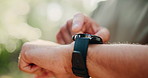 Hands, man outdoor or smart watch with fitness app, tracking heart rate or exercise progress. Bokeh, person or scroll with tech in nature for workout results, wellness update or monitor step counter.